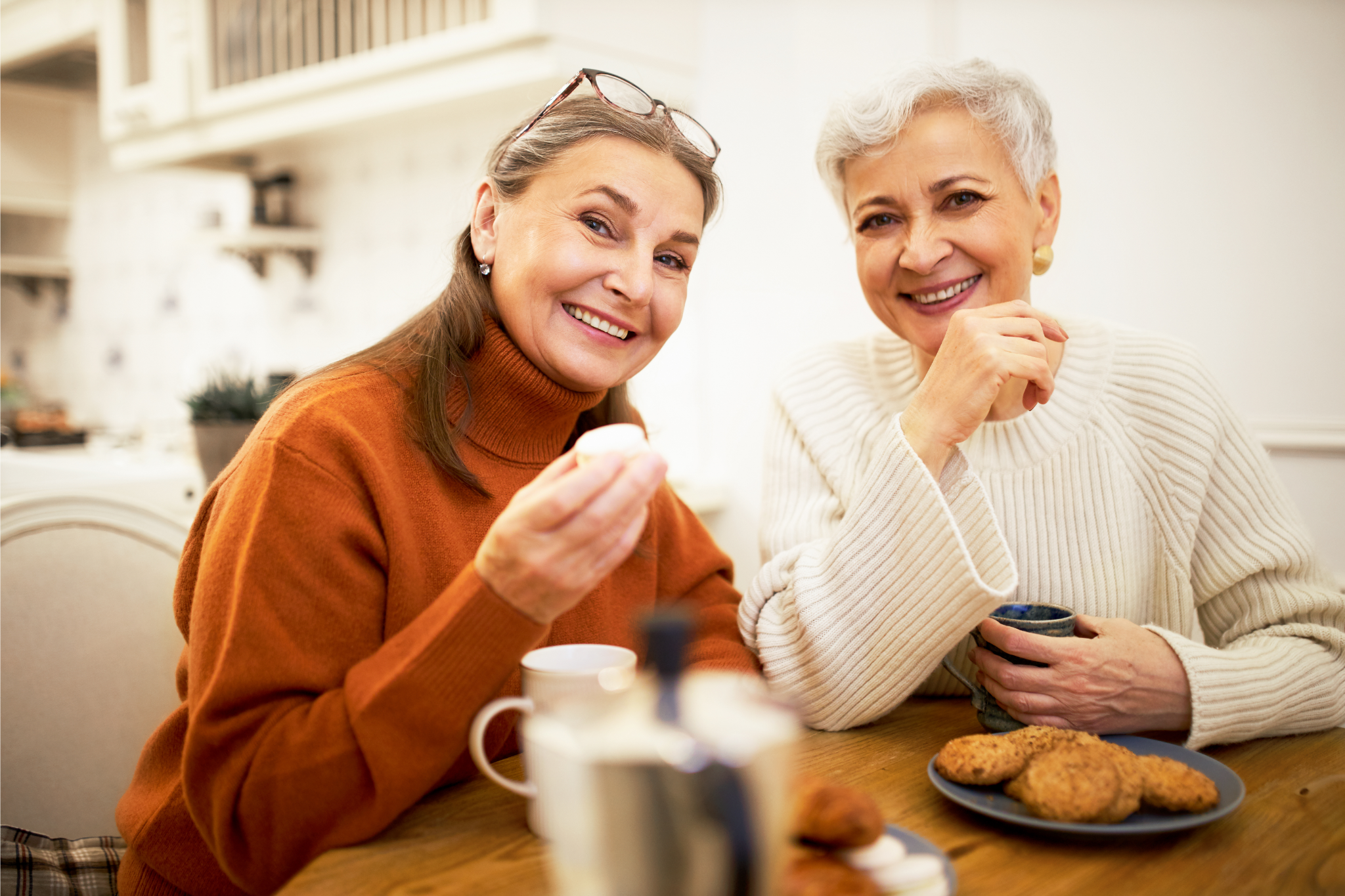 Pancreatic Health Image Alt Text: Older woman enjoying tea and biscuits