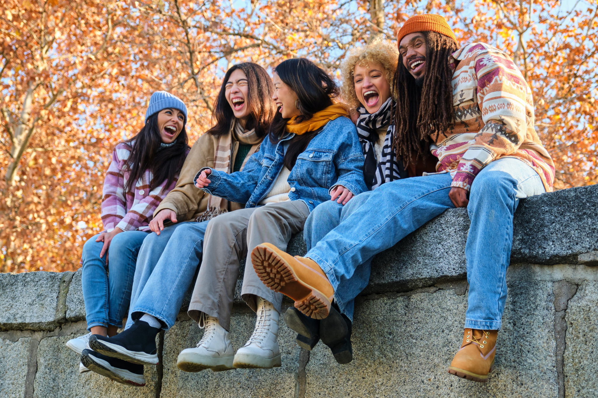 Full Blood count image alt test group of young people sitting on a wall laughing