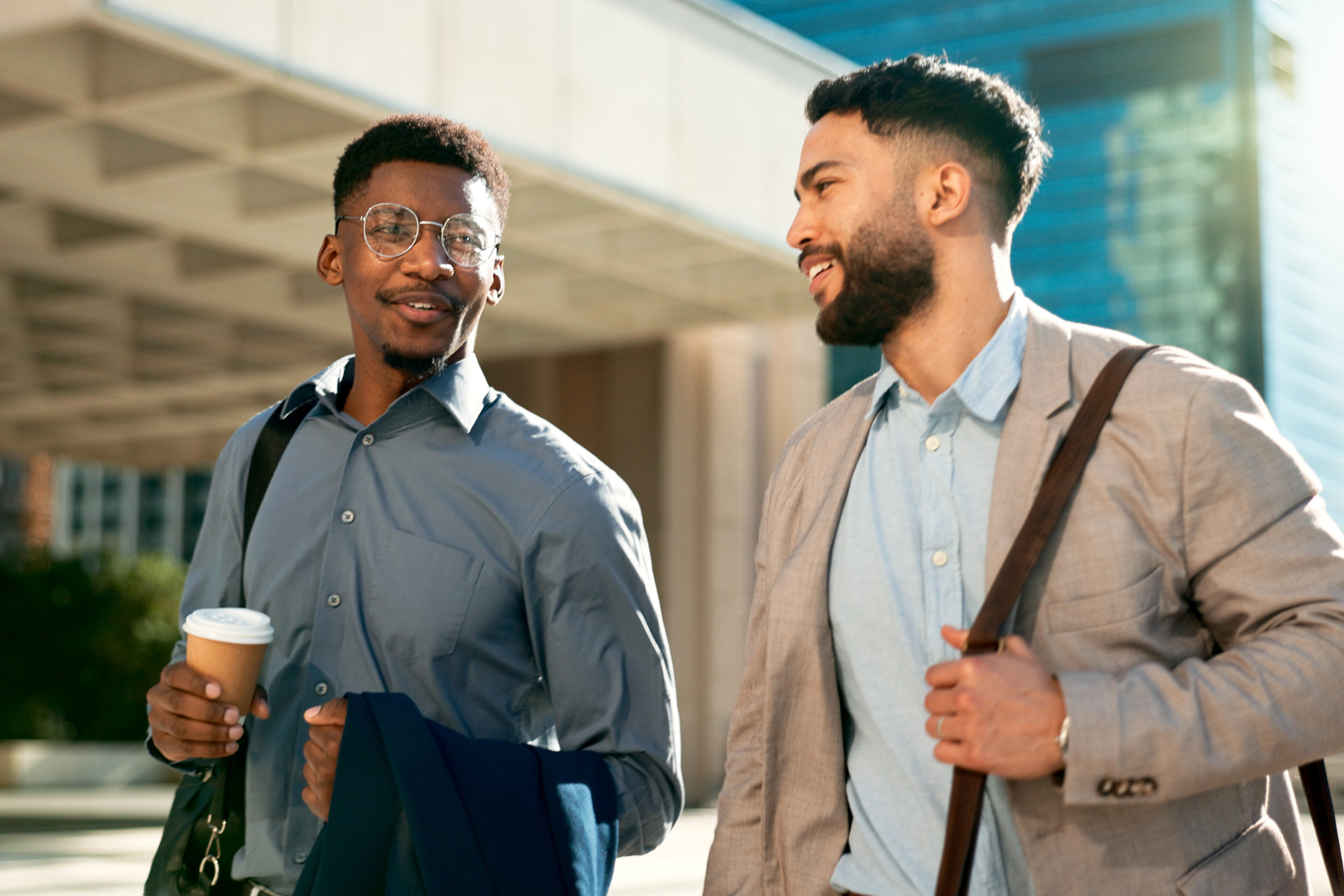 Male Hormonal Health Image, Alt Text: Two young business men walking to work