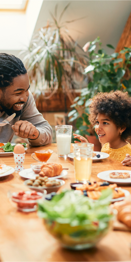 Muscle & Joint Health Img Muscle & Joint Health Img Alt Text; Young Family enjoying dinner at home at dinner table